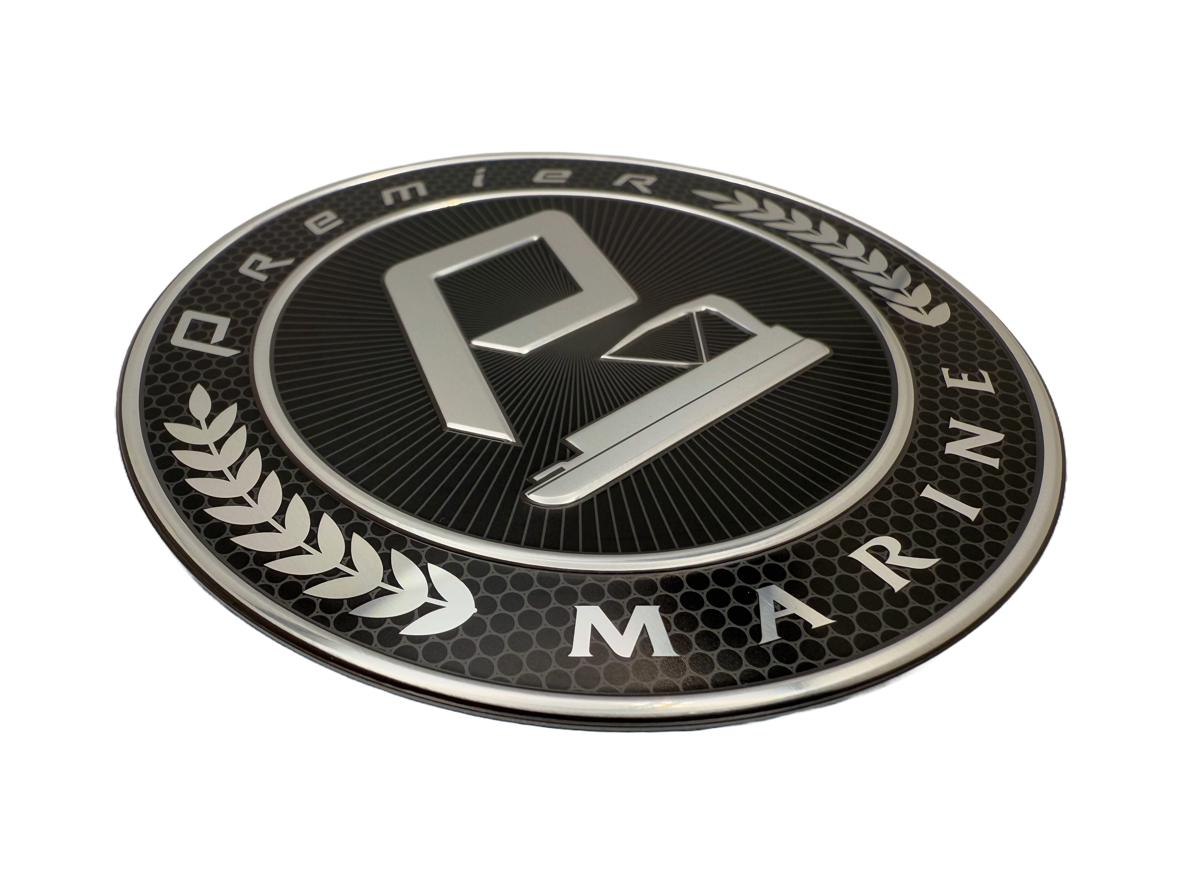 Marine badge fabricated from stamped aluminum. Logo in the middle is embossed .