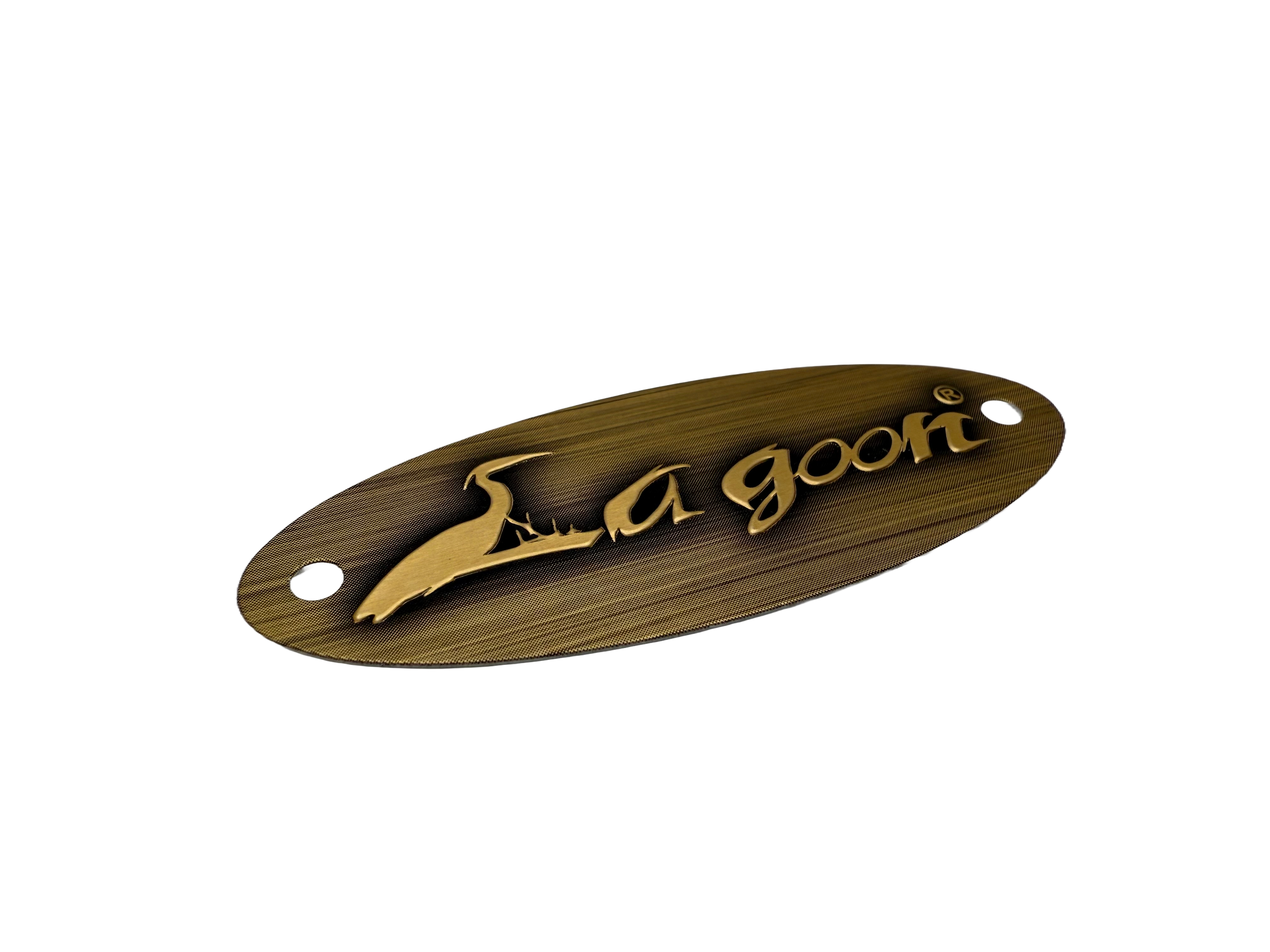 Aluminum stamped label used for furniture. Surface has been printed to mimic the appearance of brass