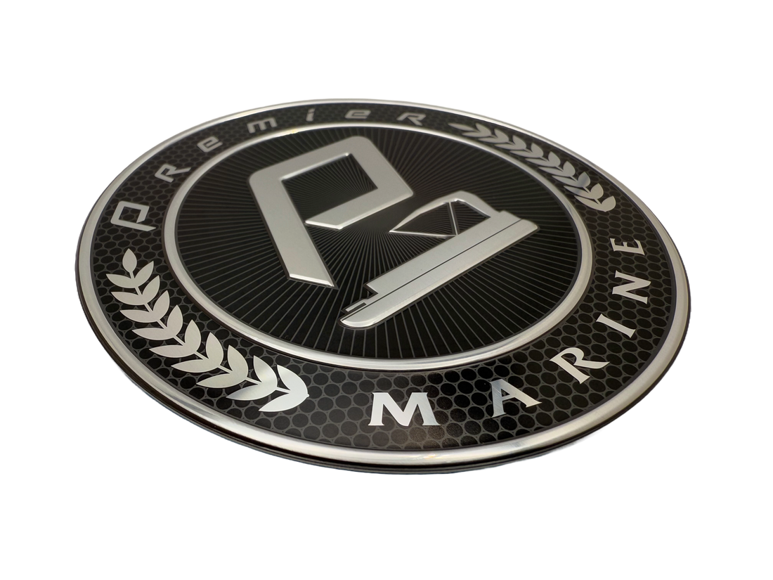 Marine badge fabricated from stamped aluminum. Logo in the middle is embossed .