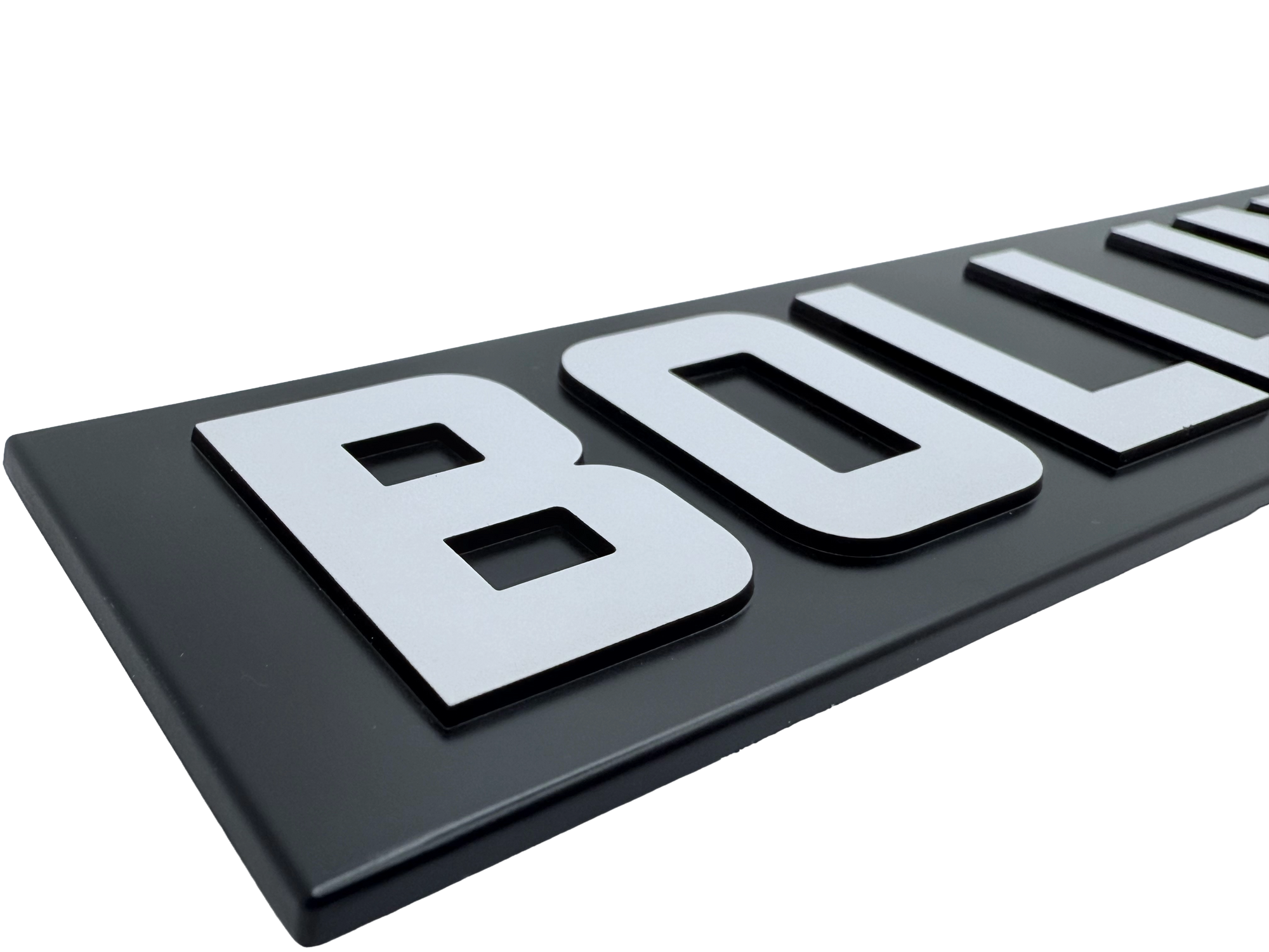 Precision engineered badge