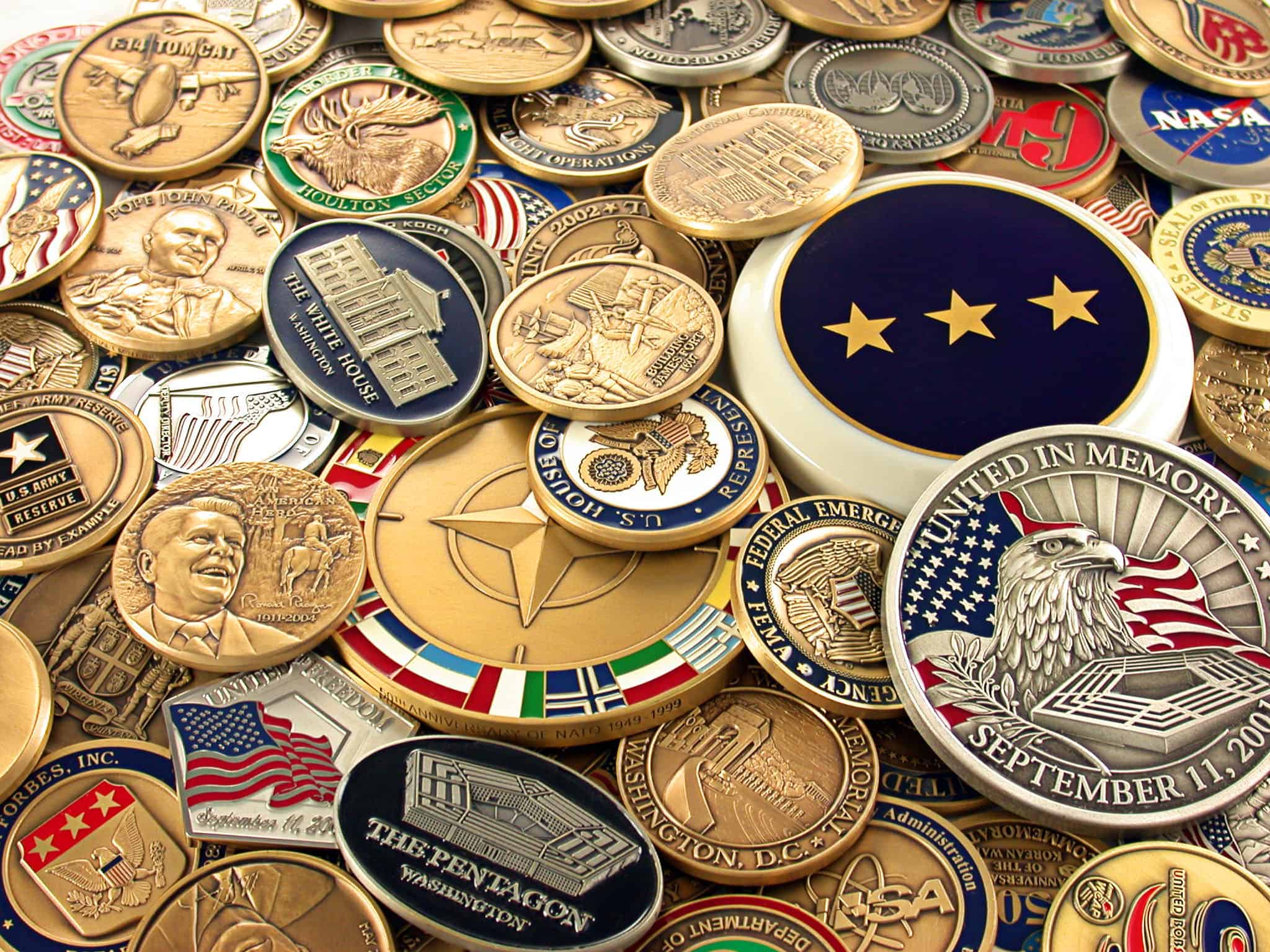 A collection of different types of custom challenge coins