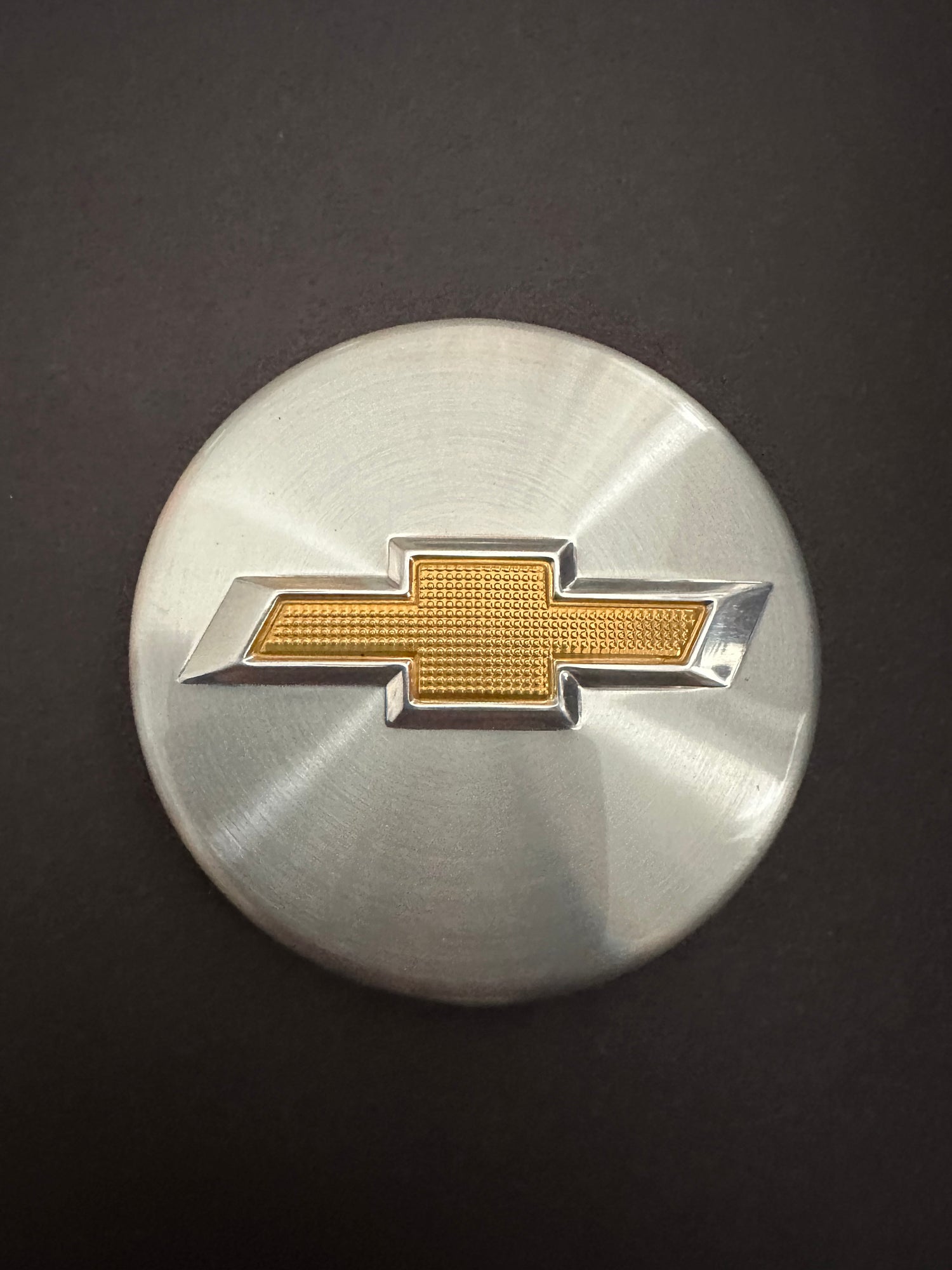 Custom car badge stamped for Chevy wheels