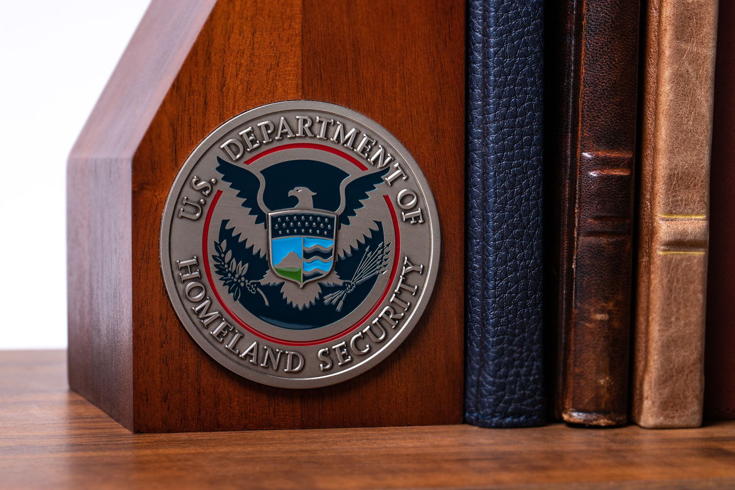 Challenge coin attached to a wooden platform