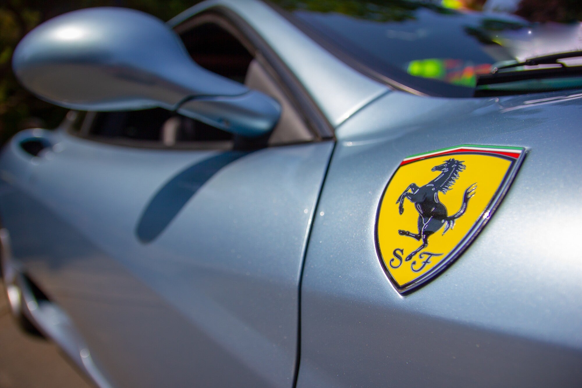 A ferrari displaying its beautiful car badge