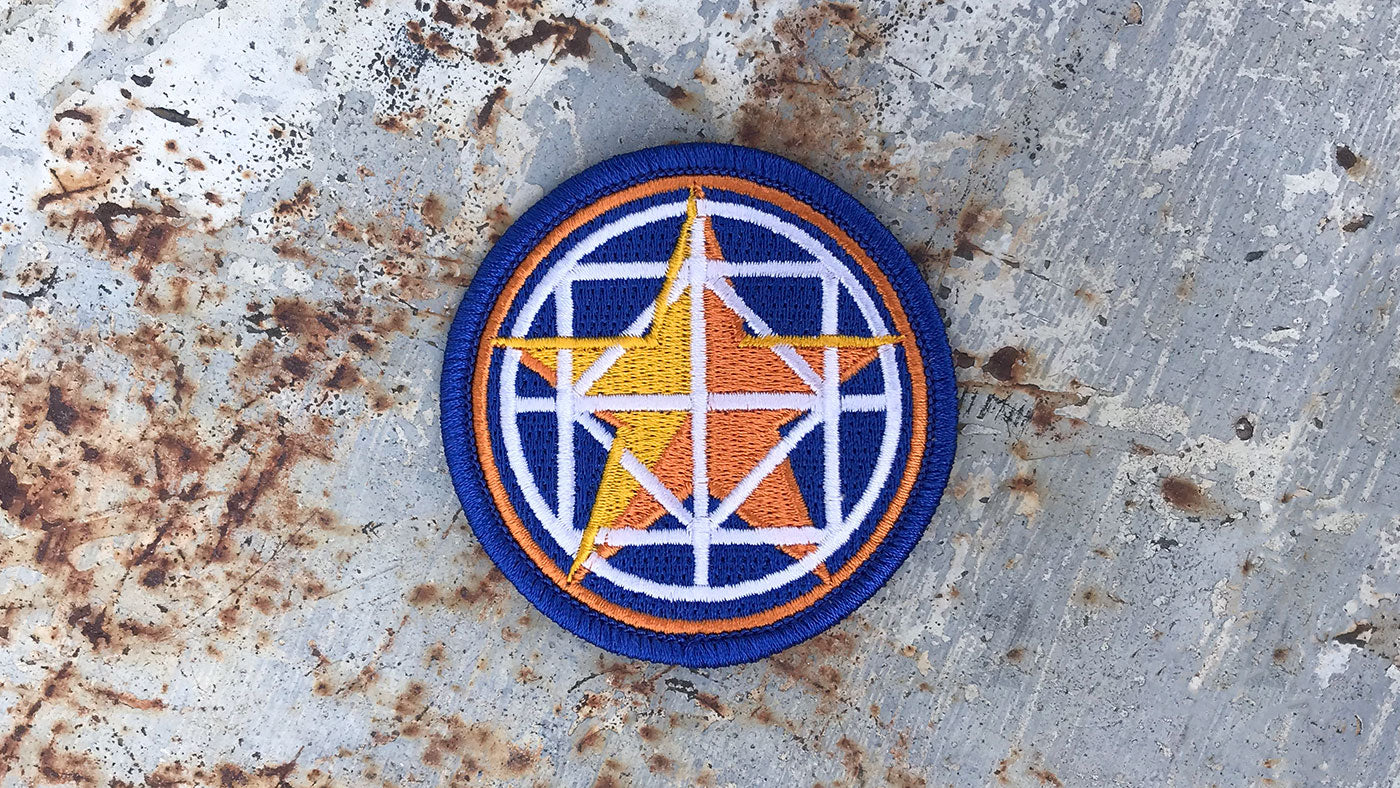 Blue embroidered patch with an orange star on the front