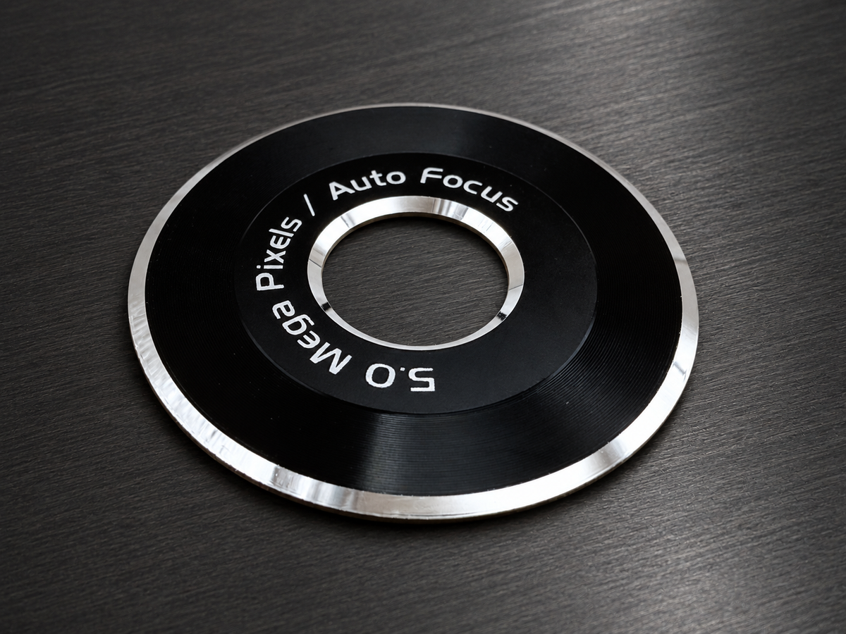 Precision etched decorative metal trim ring with black and silver finish
