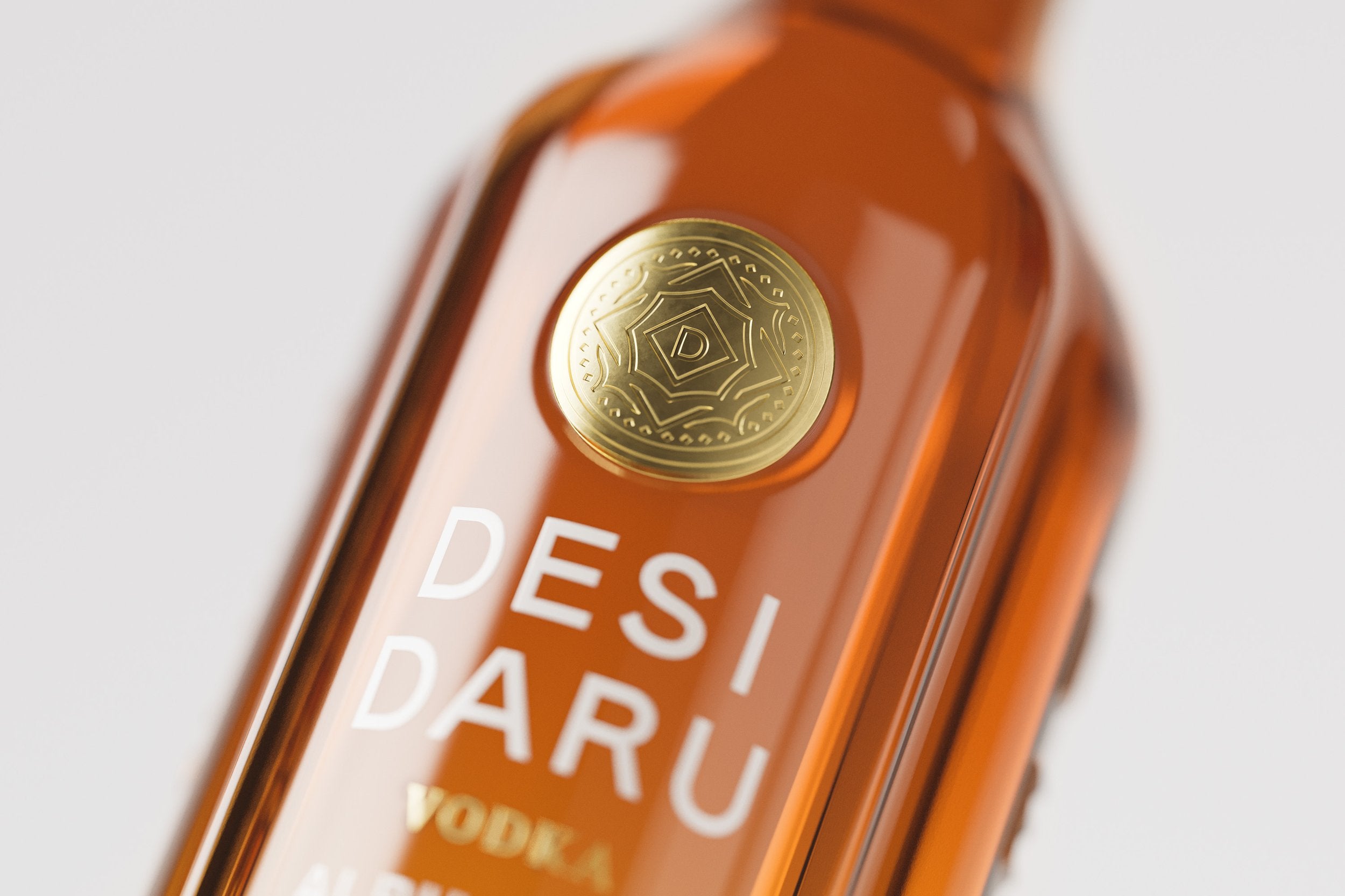 Embossed gold coin on a vodka bottle