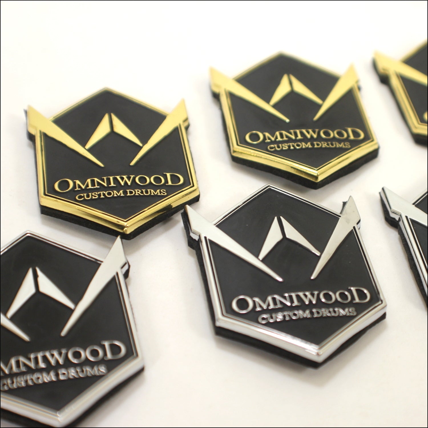 Die casted custom badges used for instruments