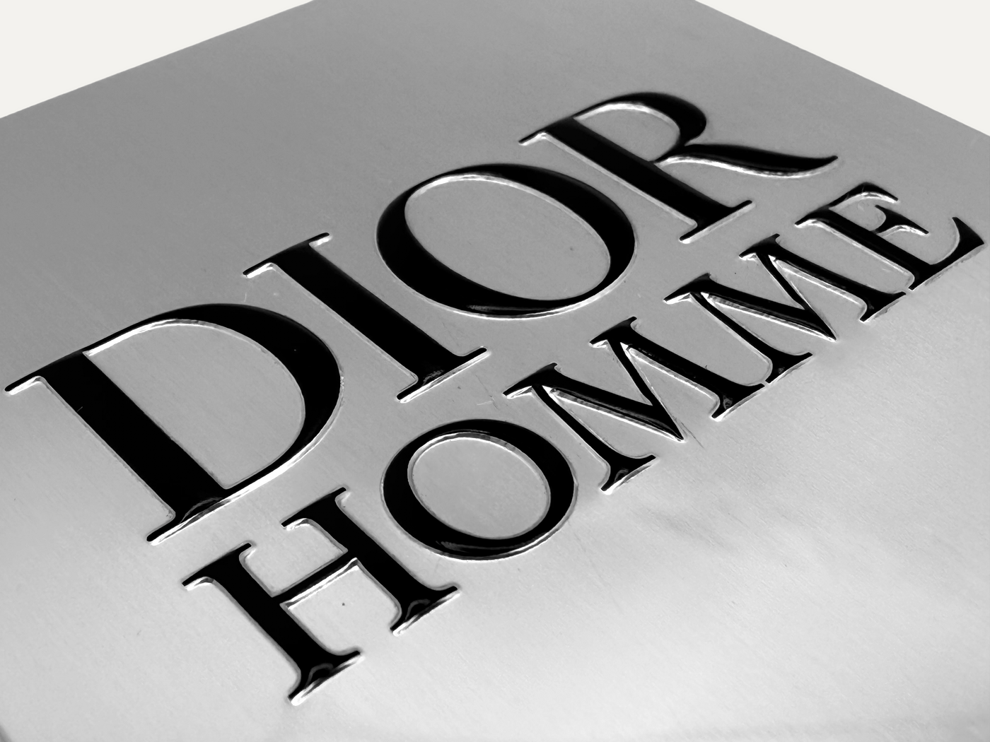 Dior nameplate from mirror aluminum with embossing and printing. 