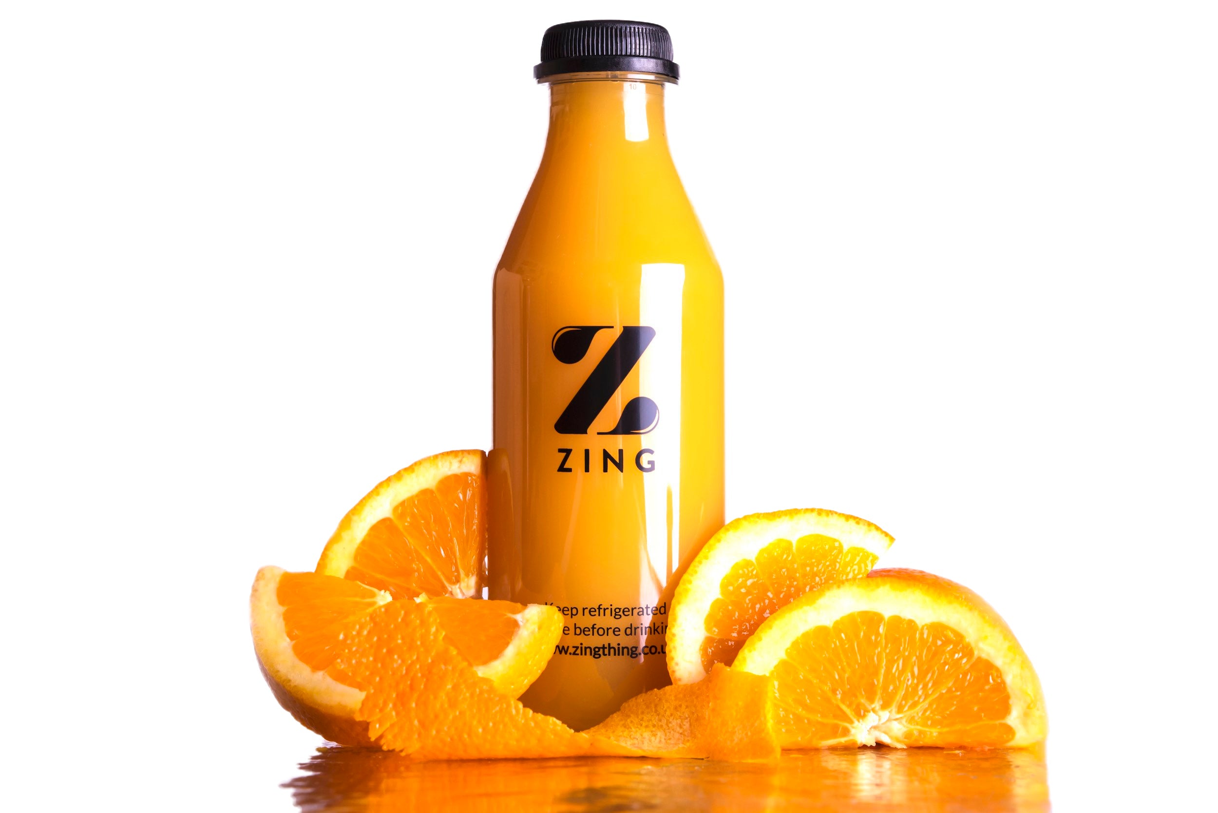 A beverage made with oranges and a printed on label