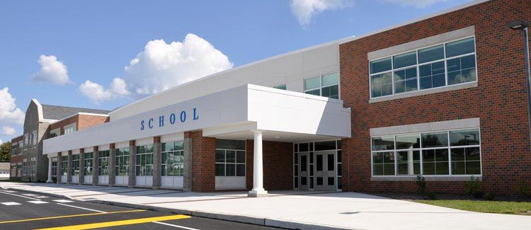 School proudly displaying its name across the front with metal letters