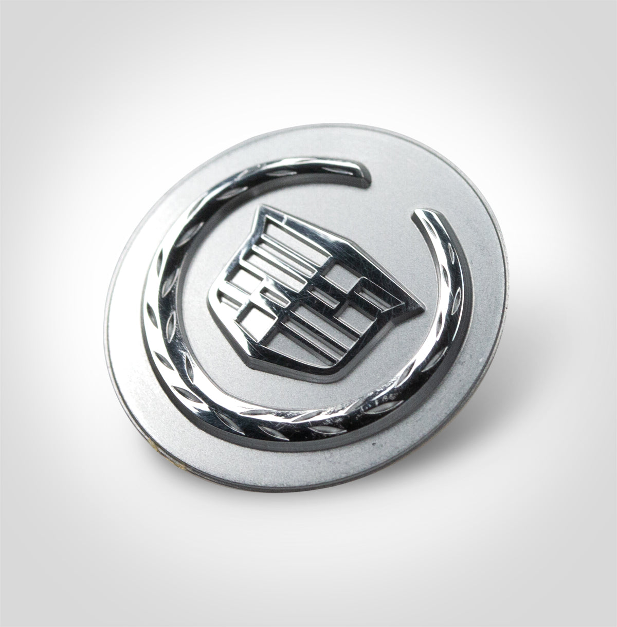 Cadillac car badge during manufacturing