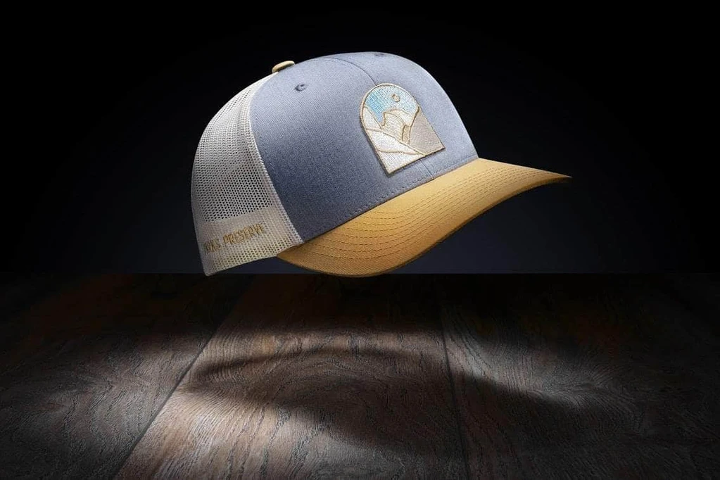A hat with a woven patch on the front panel