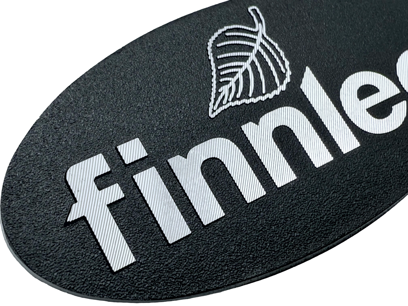 Oval shaped aluminum forged badge with diamond cutting. 
