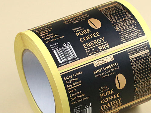 A roll on black with gold lettering aluminum foil labels
