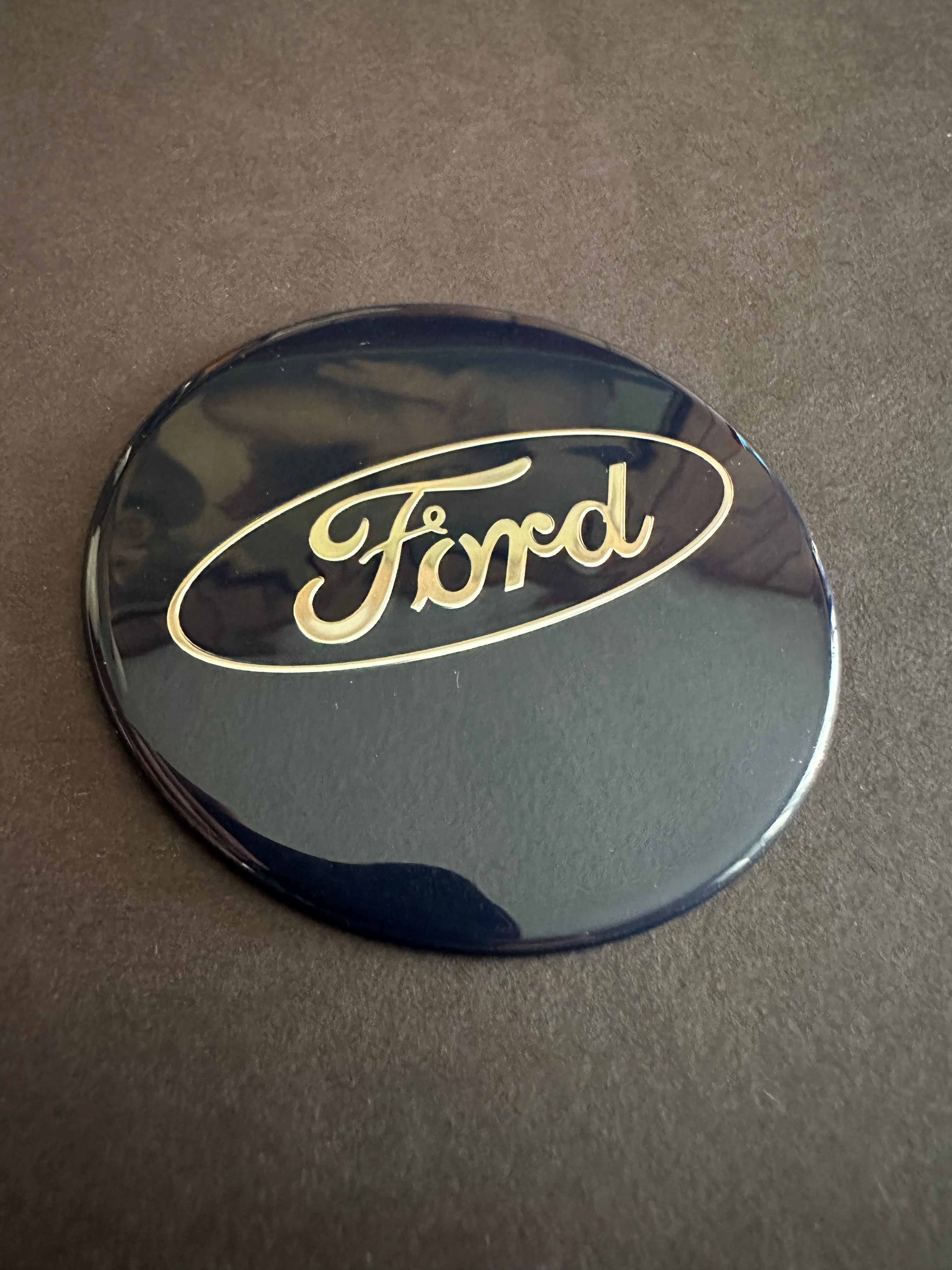 Custom car badge used for the wheels on certain Ford models