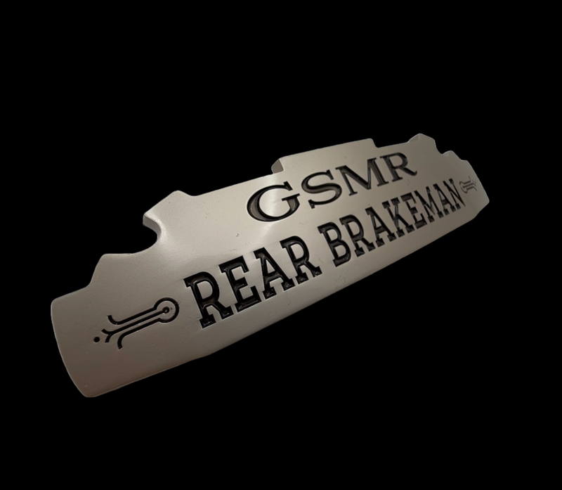 Engineered badge construction for premium retail and product branding.