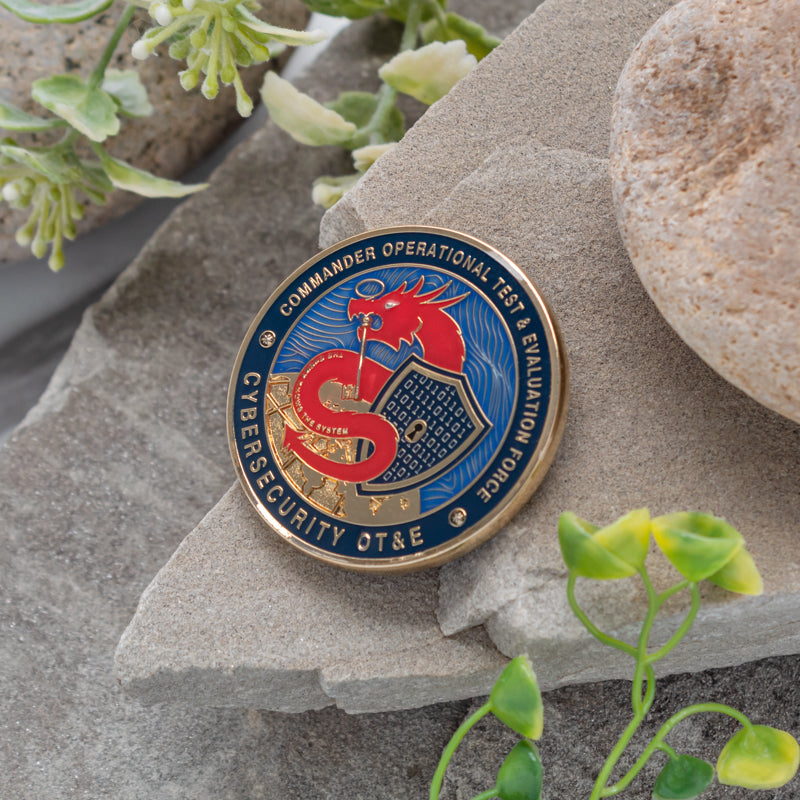 Hard enamel circular medal leaning against a rock