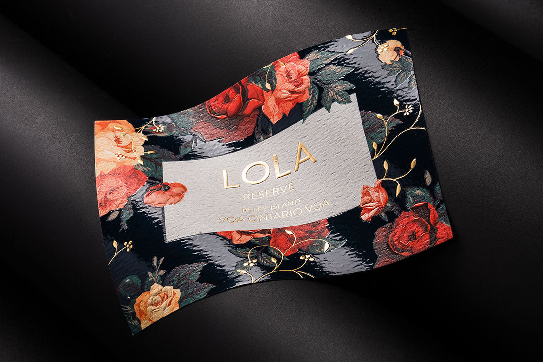 A beautiful hot foil label, with an embossed surface. The design includes flowers and the company name in the middle