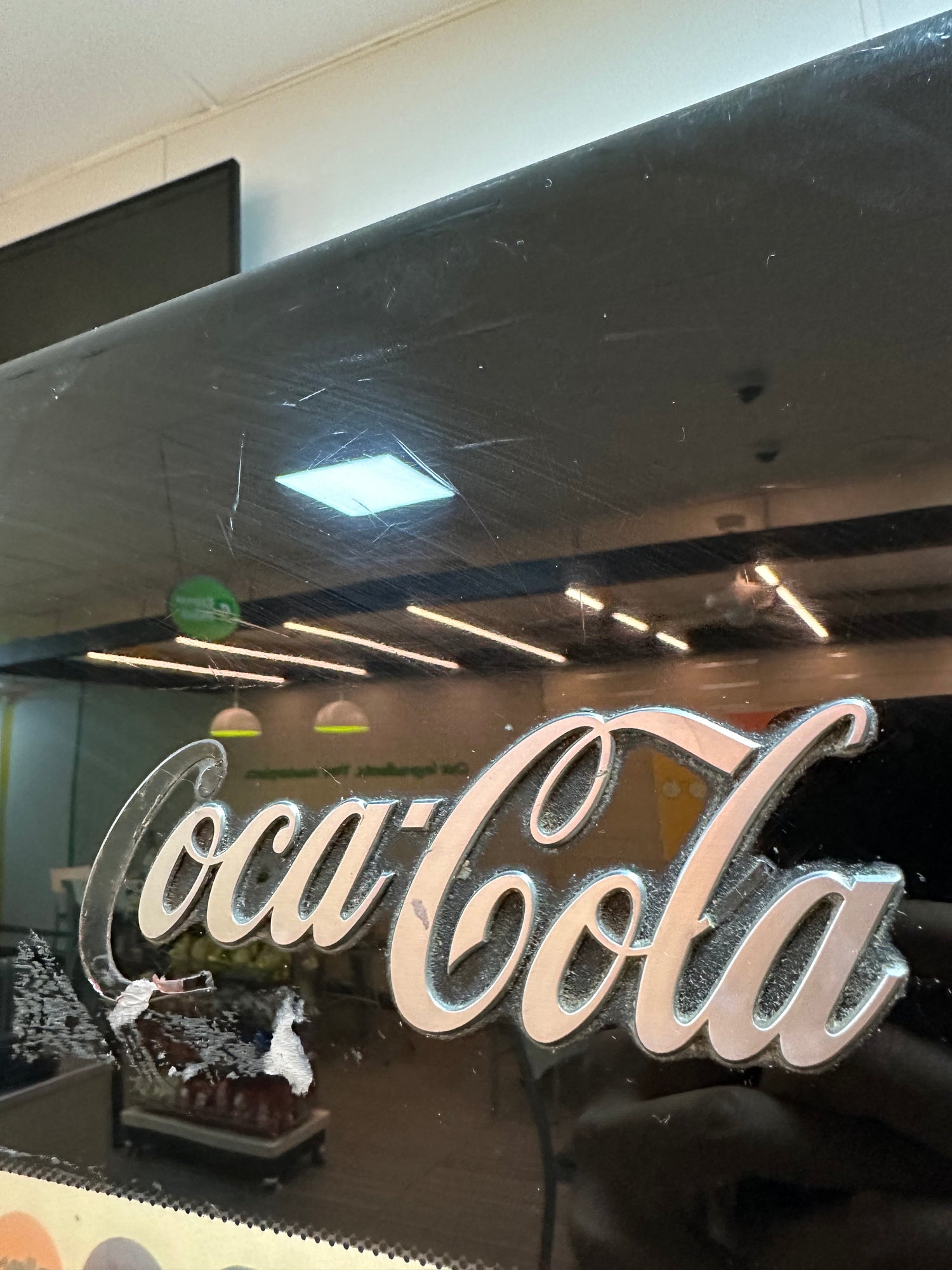 Custom badge made for Coca Cola that started to break. 