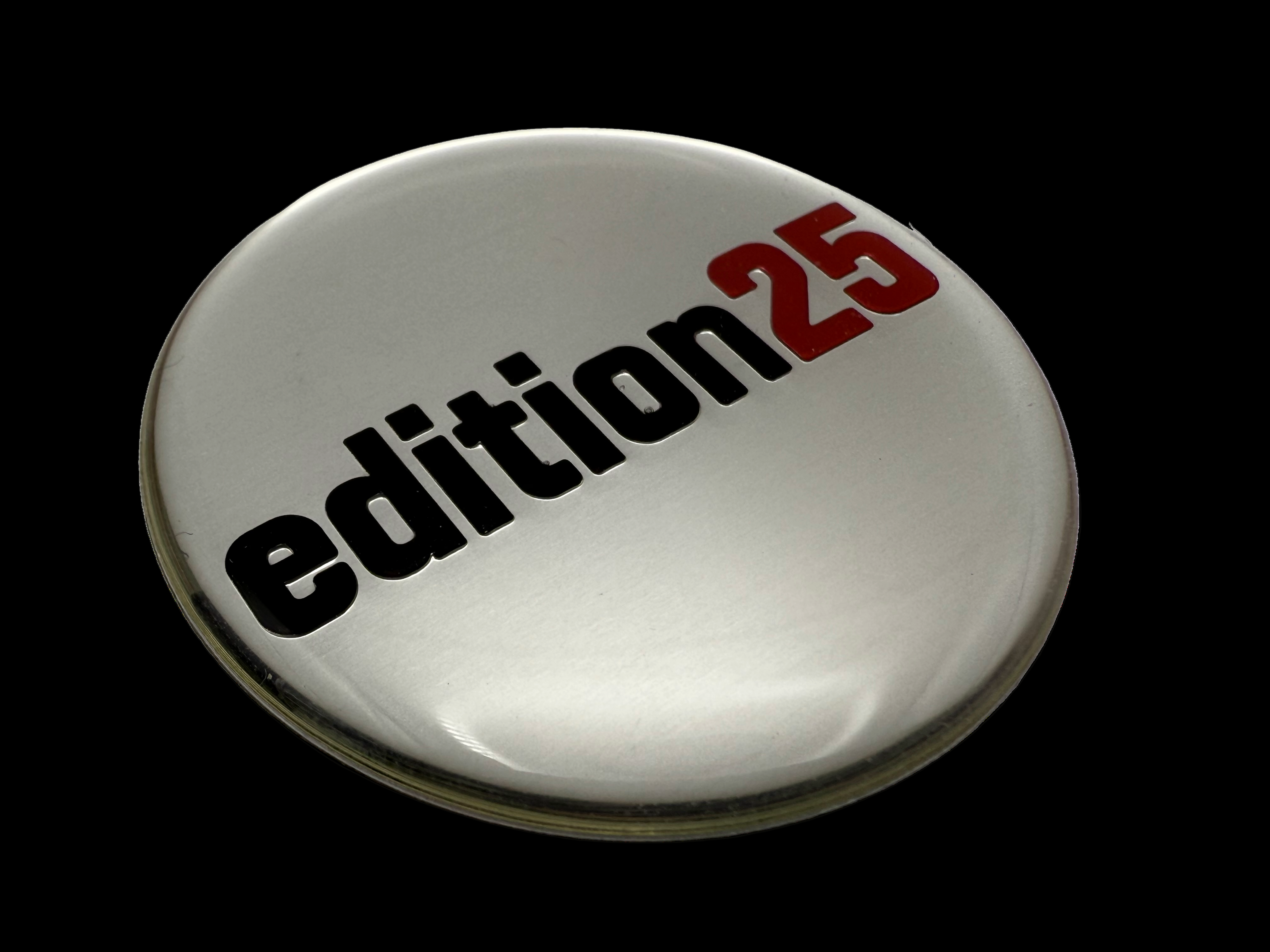 Polycarbonate polyurethane resin domed label with silver, black and red printing. All text is raised. 