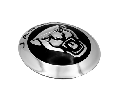 Jaguar truck badge fabricated from aluminum with screen printing, embossing, debasing and rolled edges