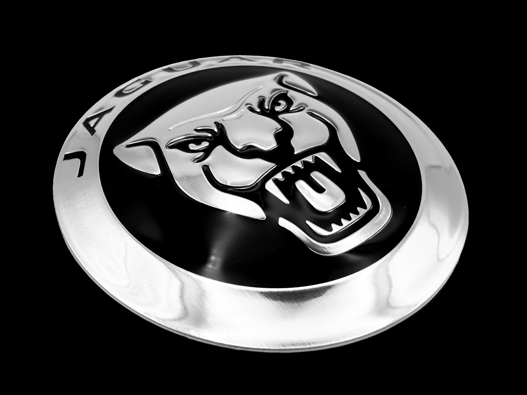 Jaguar car badge fabricated with mirror aluminum, sculpted logo and black screen printing. 