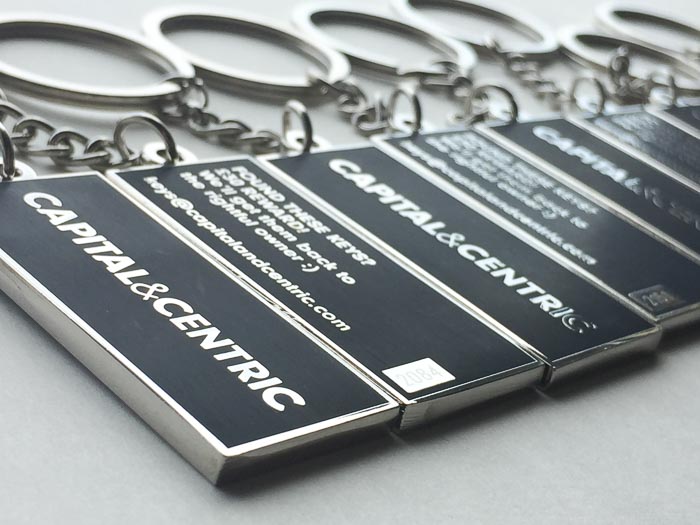 Collection of custom keychains made using chemical etching