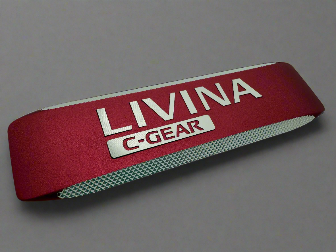 Truck emblem produced with forged aluminum, diamond cutting, red anodizing and tabs. 