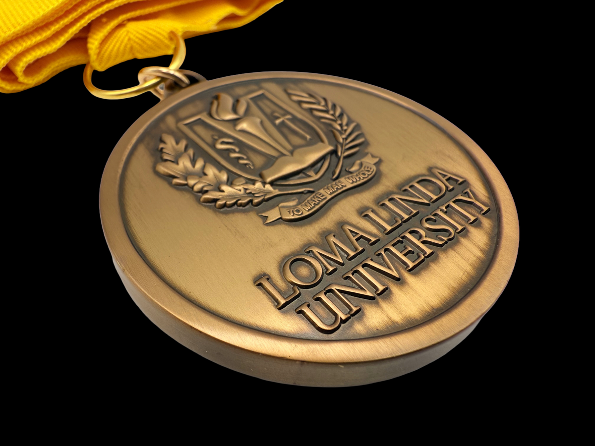 Medal crafted for Loma Linda University from die struck brass and antique gold plating. 