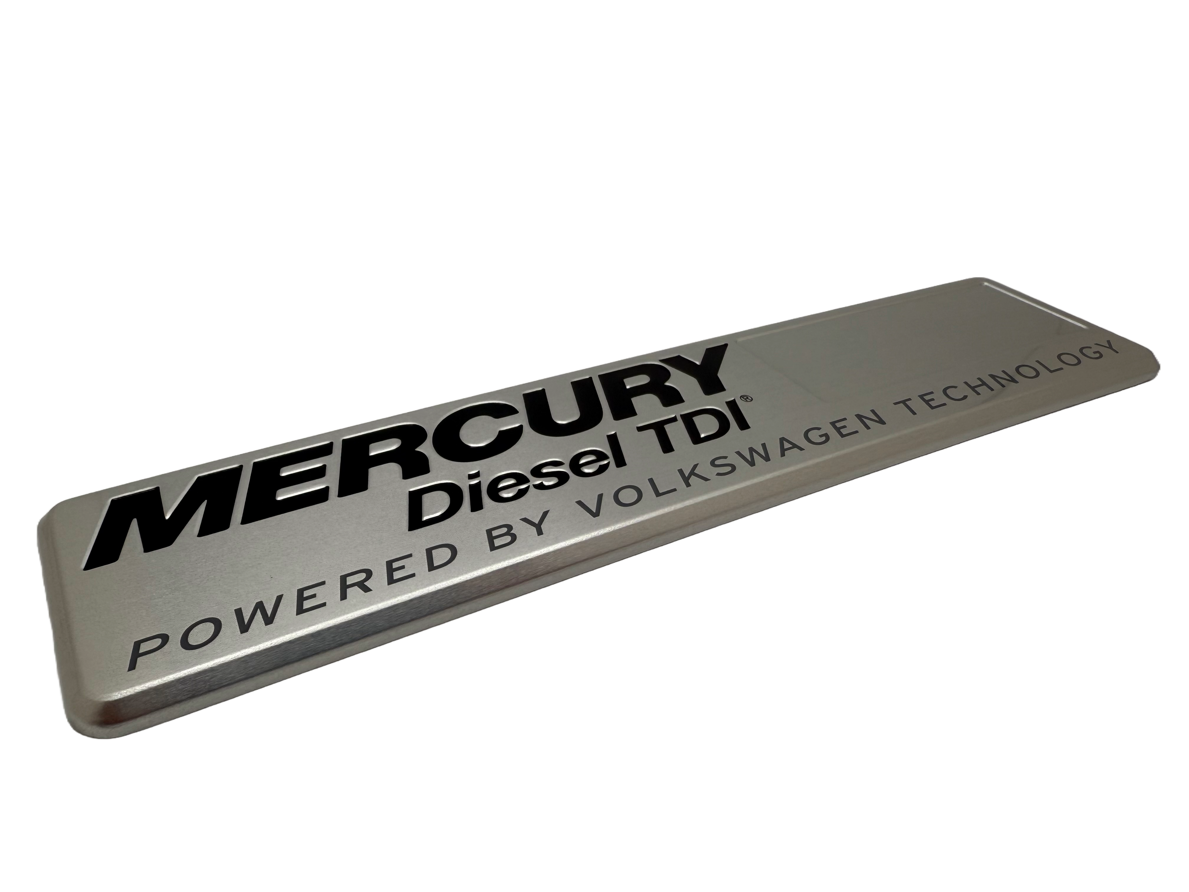 Marine badge produced using stamped aluminum with black printing and rolled edges.
