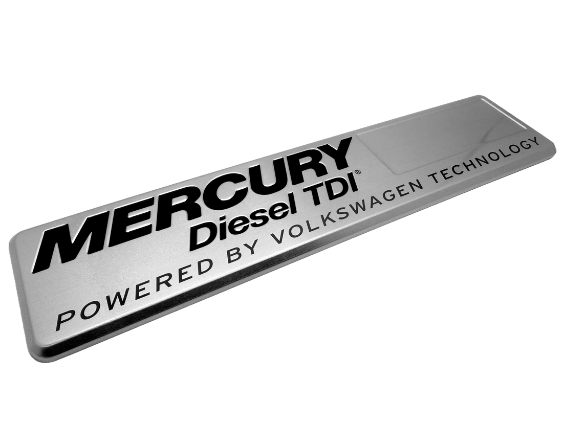 Debossed aluminum nameplate with black screen printing for durability