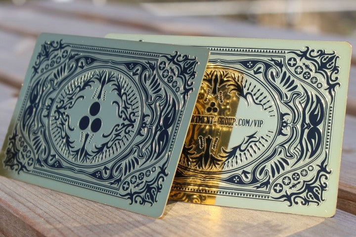 Gold metal business cards with black embossed design