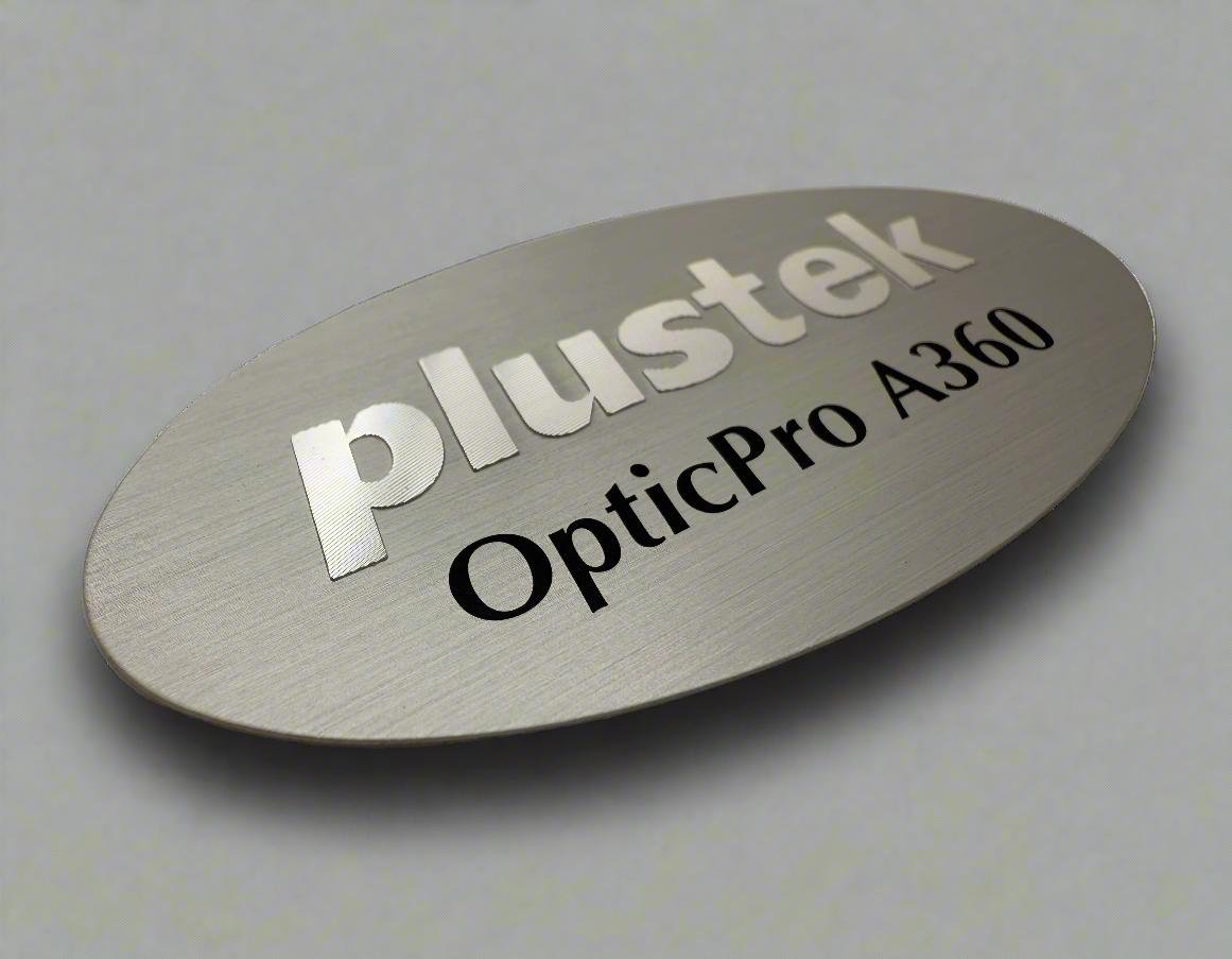Plustek OpticPro A360 equipment nameplate. Plustek is embossed and diamond cut. OpticPro A360 has been screen printed on. 