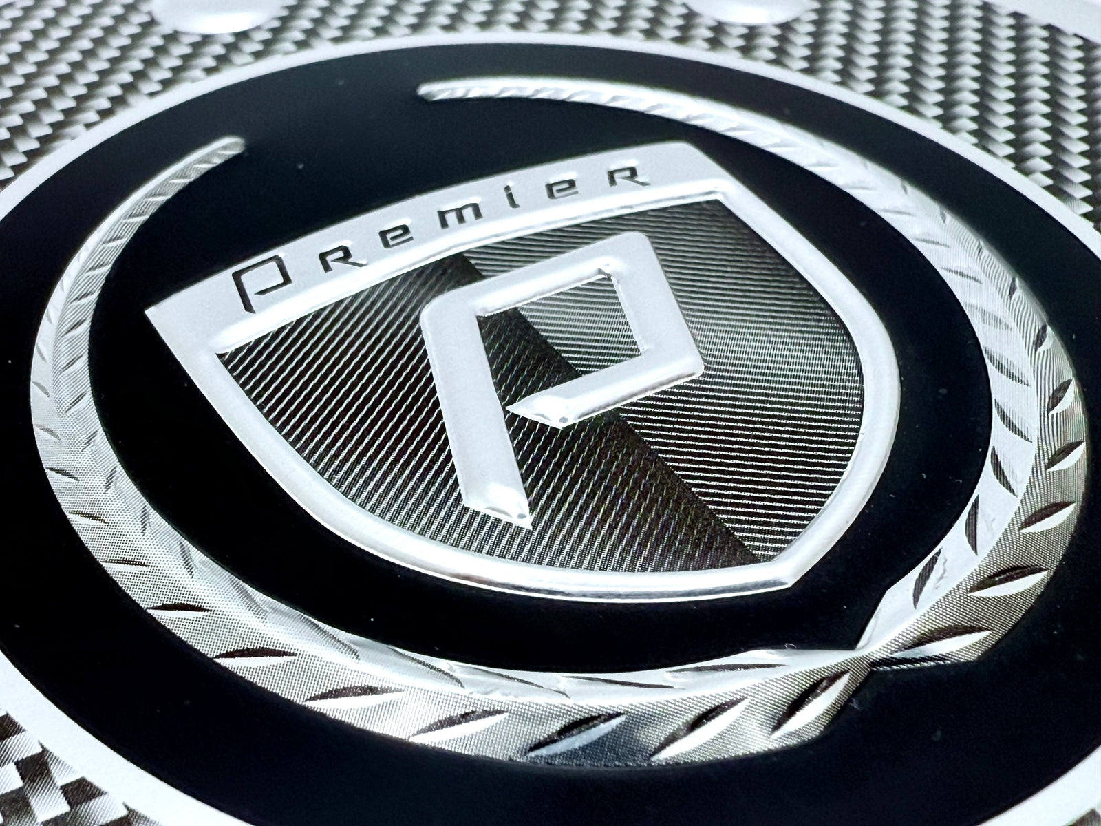 Sculpted aluminum badge with printing