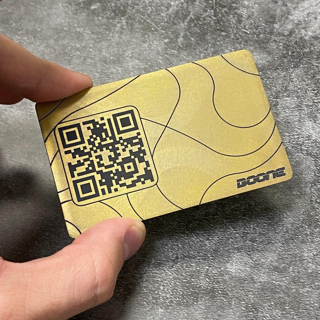 Gold business card with qr code on the surface