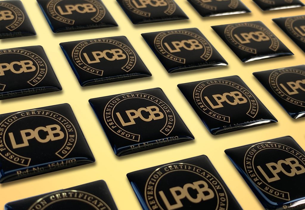 A collection of black domes labels with gold lettering