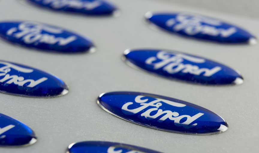 Ford oval shaped dome labels used to brand the rims of their cars