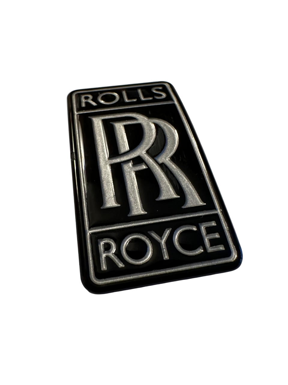 Rolls Royce badge made using stainless steel with recessed design and text.