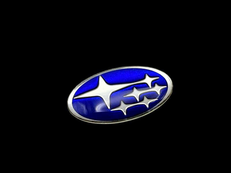 Aluminum doming at its finest. Subaru badge with embossing and classic Subaru screen printed blue for the recessed areas. 