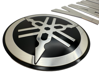 Boat badge made for branding. Logo and letters are stamped to shape. Boat lettering was produced using mirror aluminum
